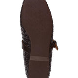 Brown shoe sole with woven pattern on a white background