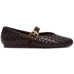 Brown woven flat shoe with a gold buckle on a white background