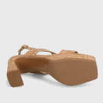 Cork sandal with a platform sole on a light gray background