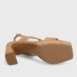 Cork sandal with a platform sole on a light gray background