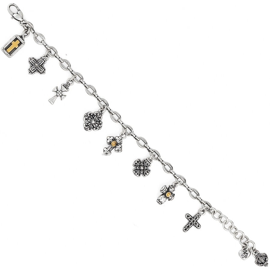 Silver bracelet with various charms on a white background