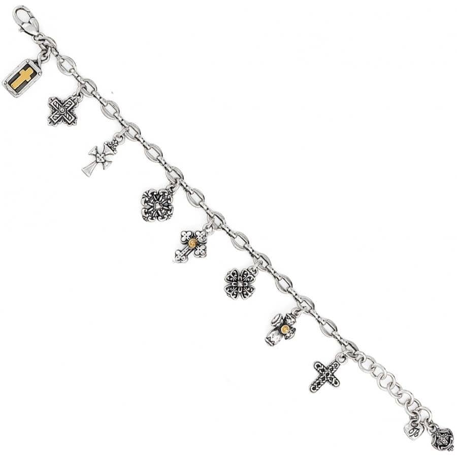 Silver bracelet with various charms on a white background