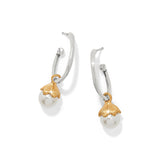 Pair of earrings with gold and silver accents on a white background