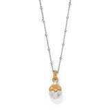 Necklace with a gold and pearl pendant on a white background