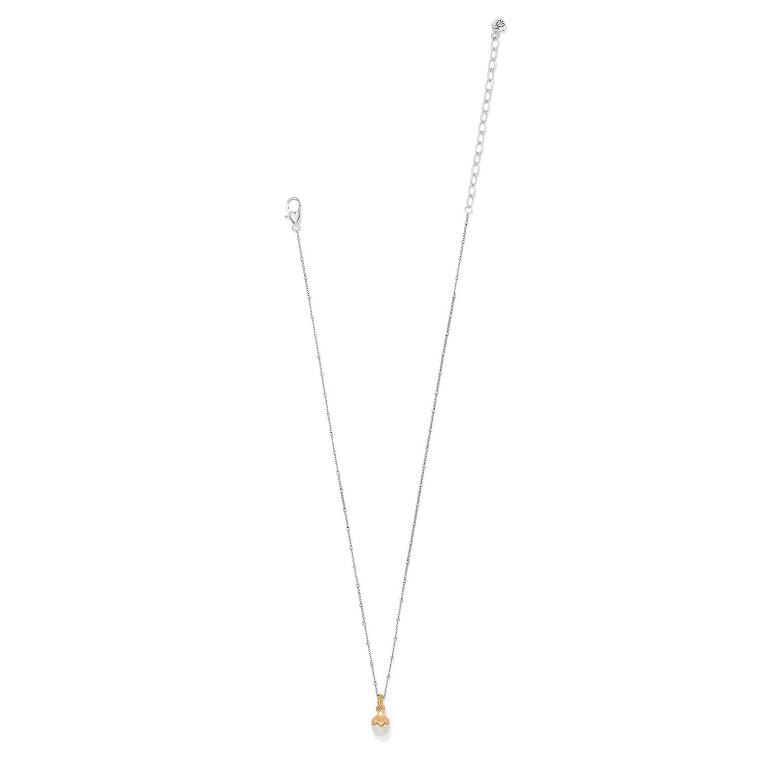 Gold necklace with a small pendant on a white background
