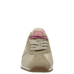 Beige sneaker with pink accents on a white background