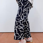 Woman wearing the FDJ Suzanne printed boot crop pant with a black and white abstract print.