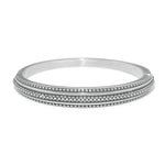 Silver bangle on a white background