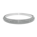 Silver bangle on a white background
