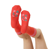 Red socks with 'FA LA LA' text on a white background