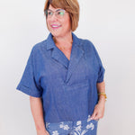 Woman wearing a blue outfit with a white background