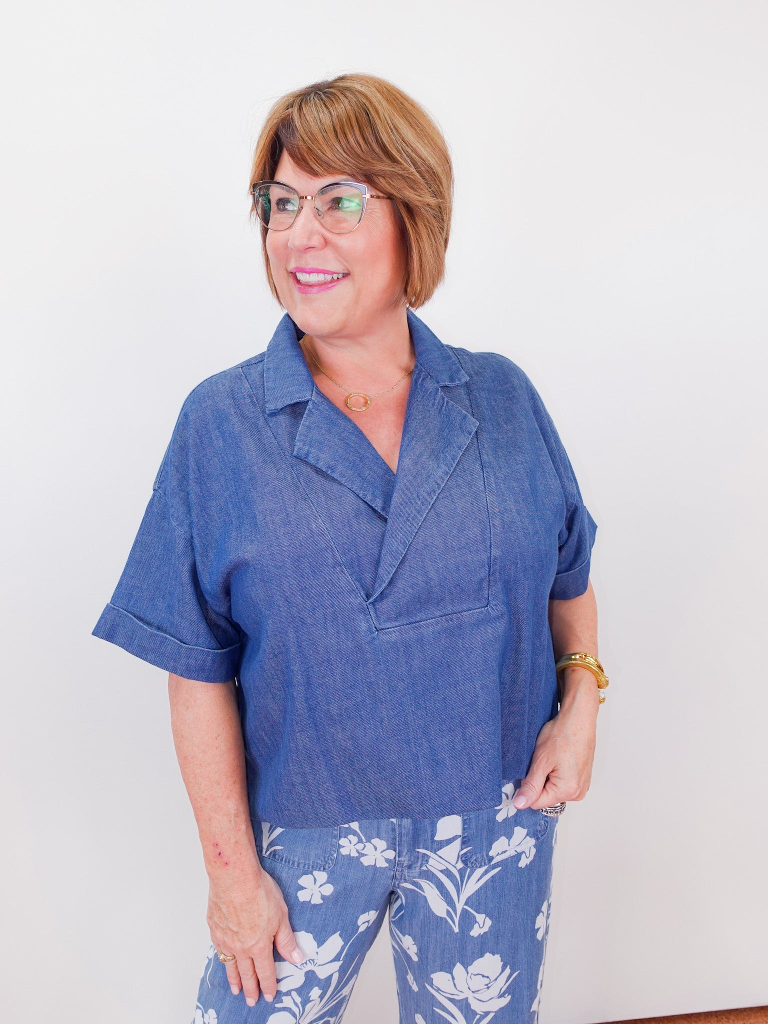 Woman wearing a blue outfit with a white background