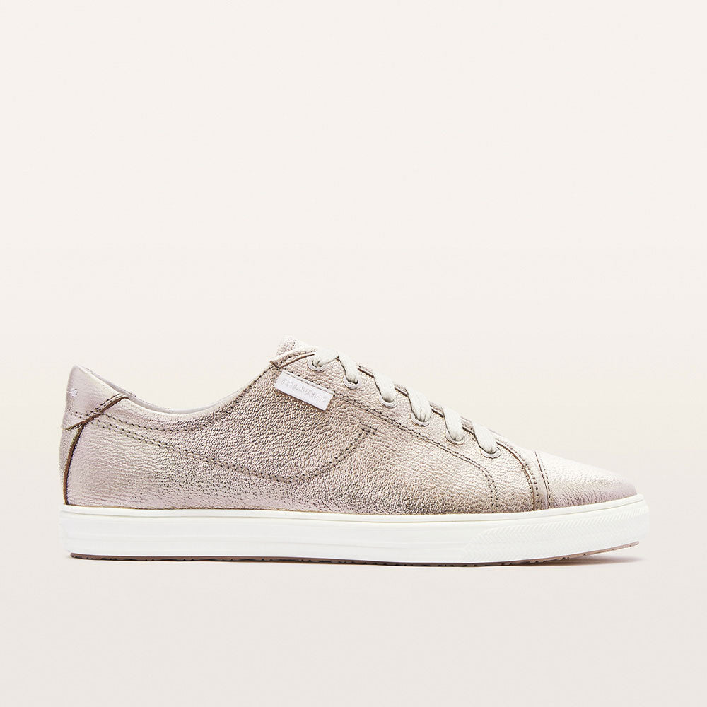 Black sneaker with white sole on a white background