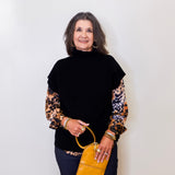 Woman holding a yellow handbag against a white background