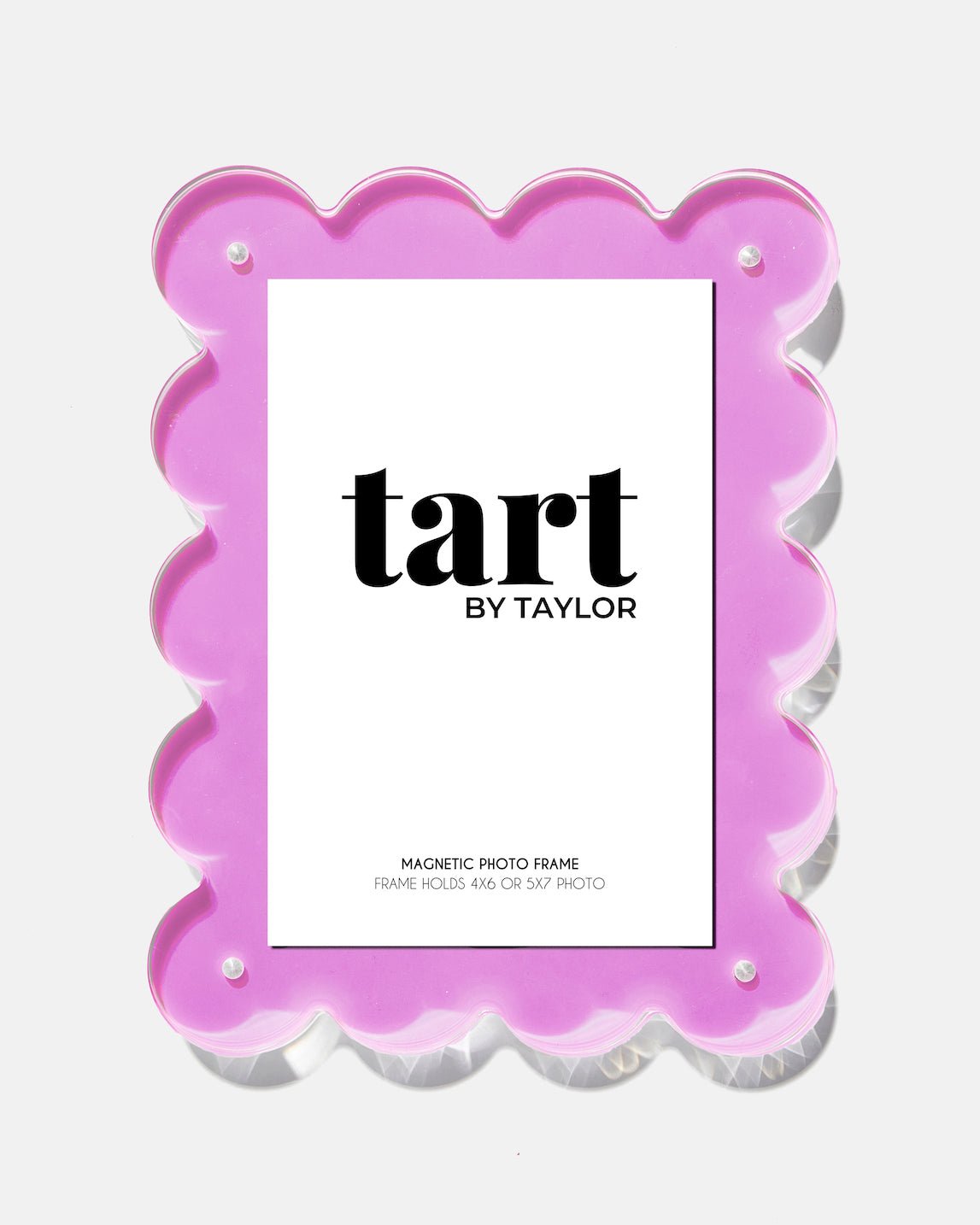 Pink scalloped photo frame with 'tart by Taylor' branding on a white background
