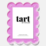 Pink scalloped photo frame with 'tart by Taylor' branding on a white background