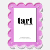 Pink scalloped photo frame with 'tart by Taylor' branding on a white background