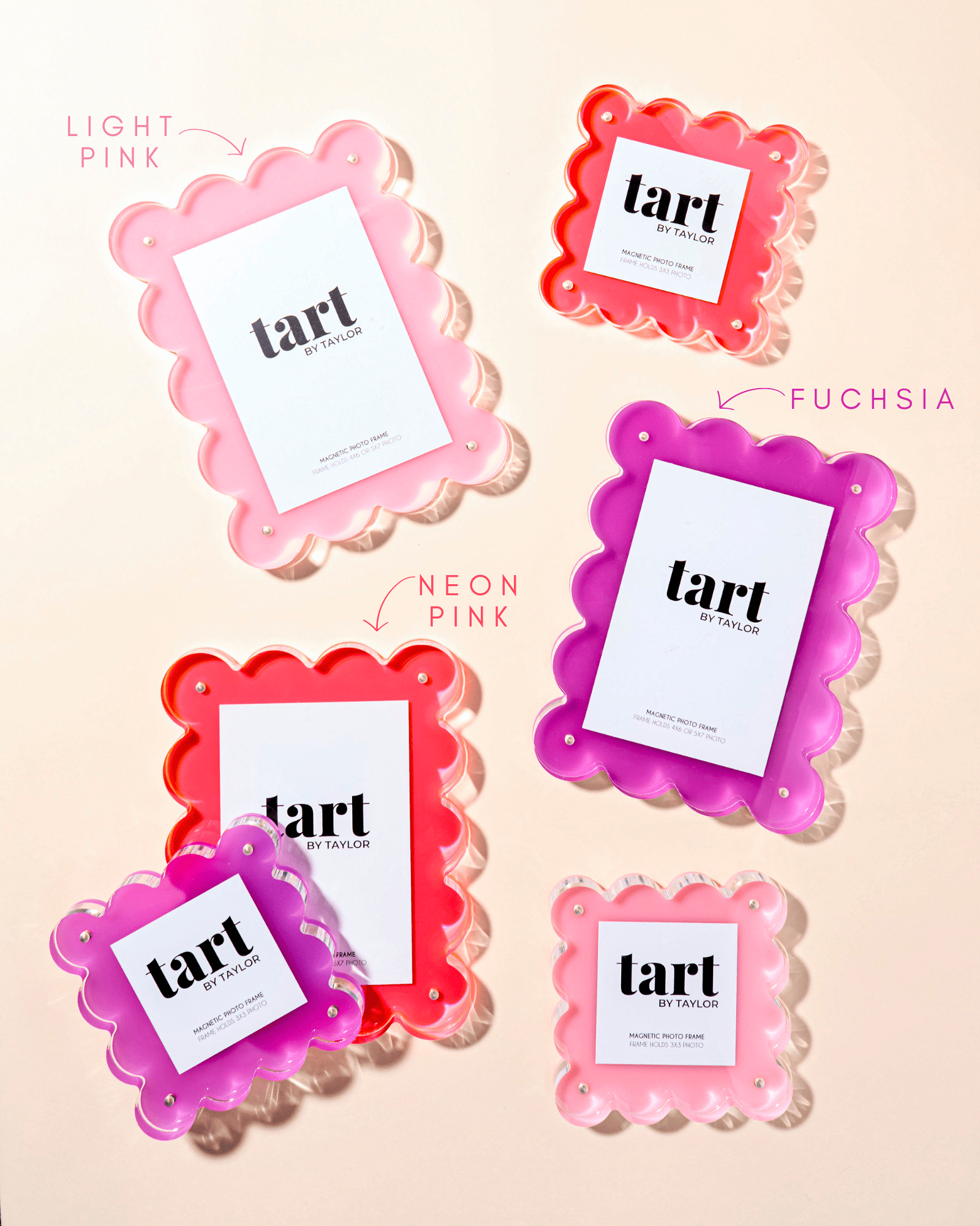Set of pink and fuchsia 'tart' products on a beige background