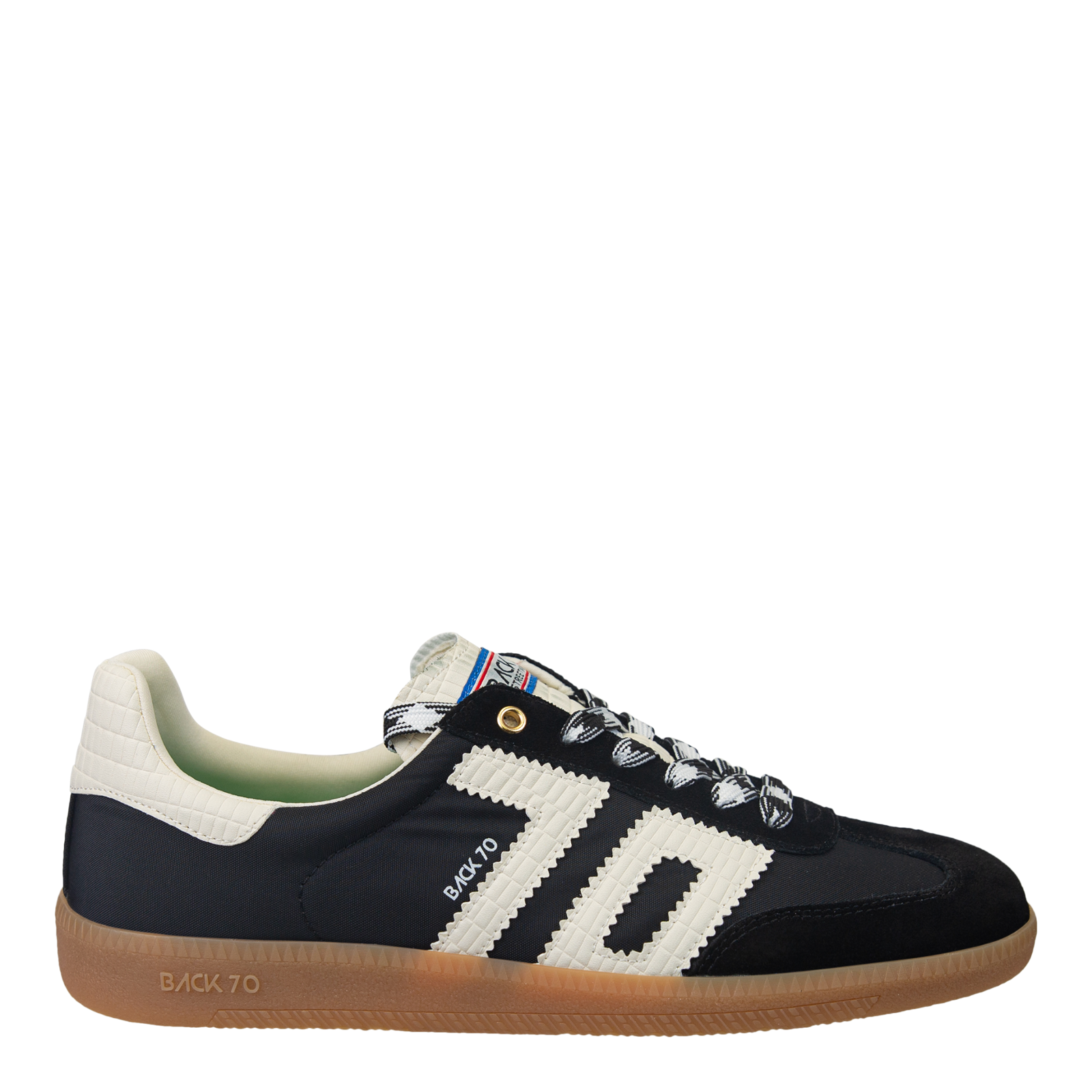 A pair of black tennis shoes with white stripes and the brand name back 70 written across the side.