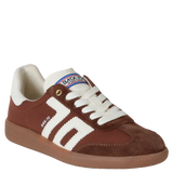 Brown and white sneaker with visible brand logo on a white background