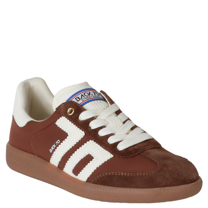 Brown and white sneaker with visible brand logo on a white background