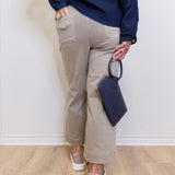 Women’s cropped wide leg pants featuring patch pocket detail in front. a white background. 
