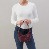 Hobo Astrid Small Crossbody in mulberry glaze leather with top zip closure and adjustable strap.