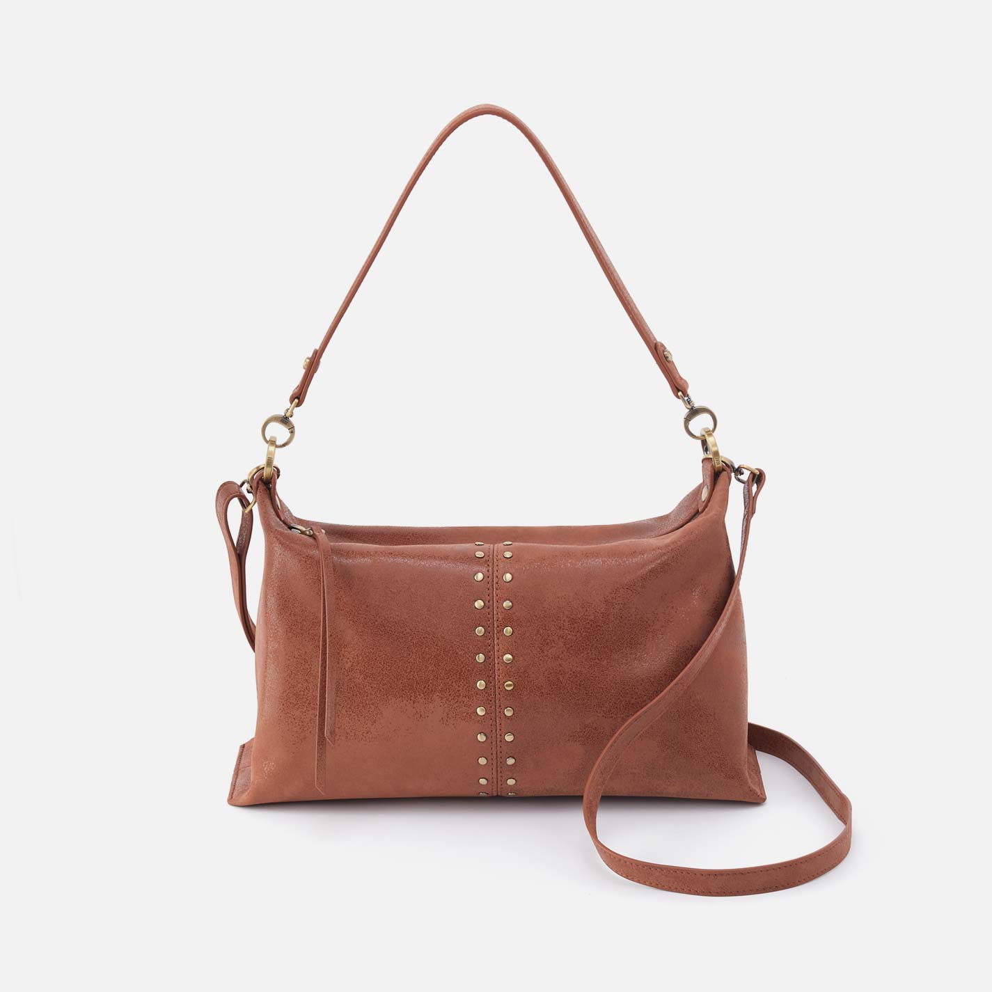 Brown leather handbag with decorative studs on a white background