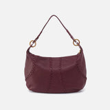 Maroon handbag with gold accents on a white background