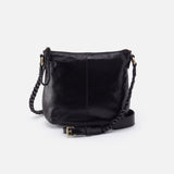 a black hobo medium crossbody against a white background. 