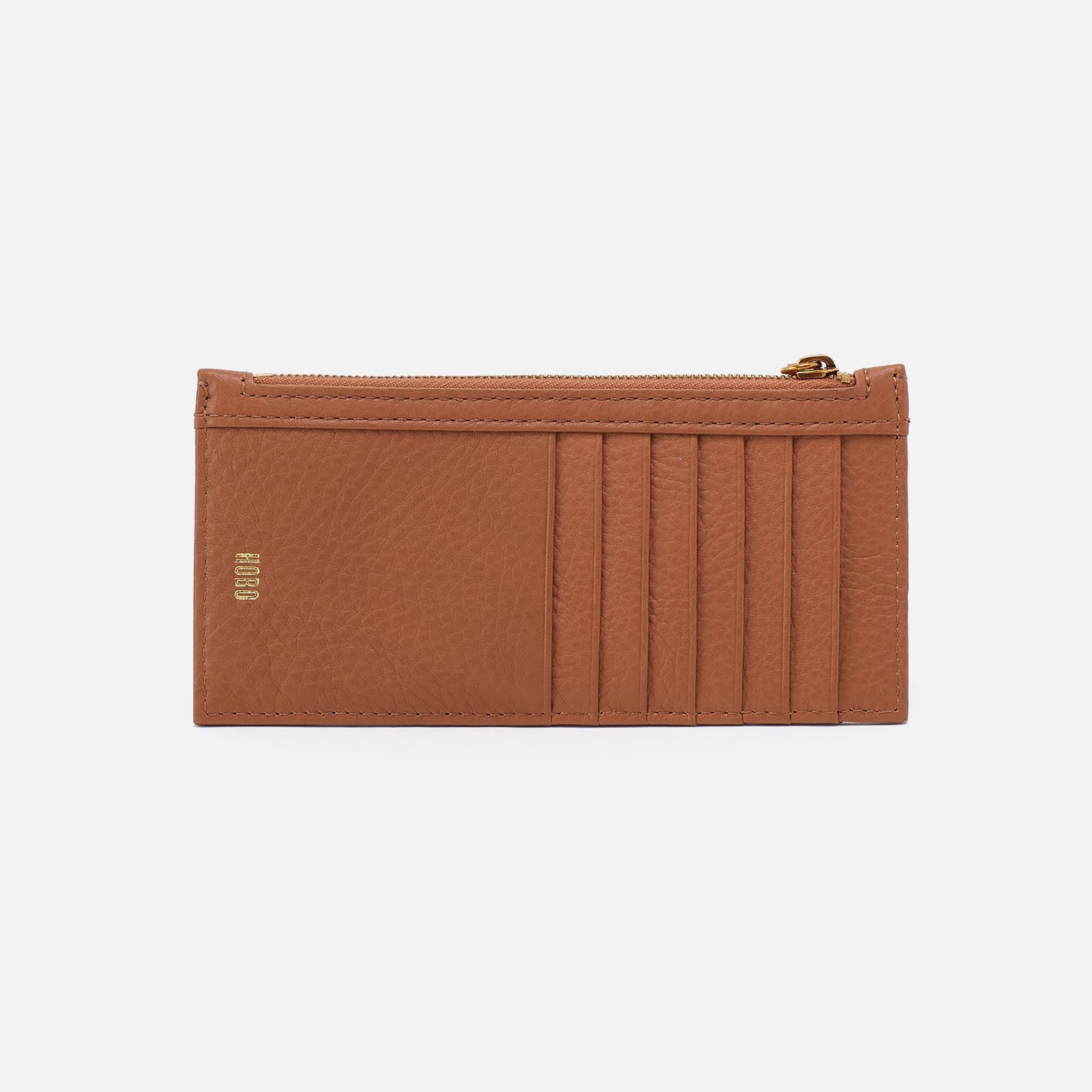 Brown leather wallet with card slots on a light beige background