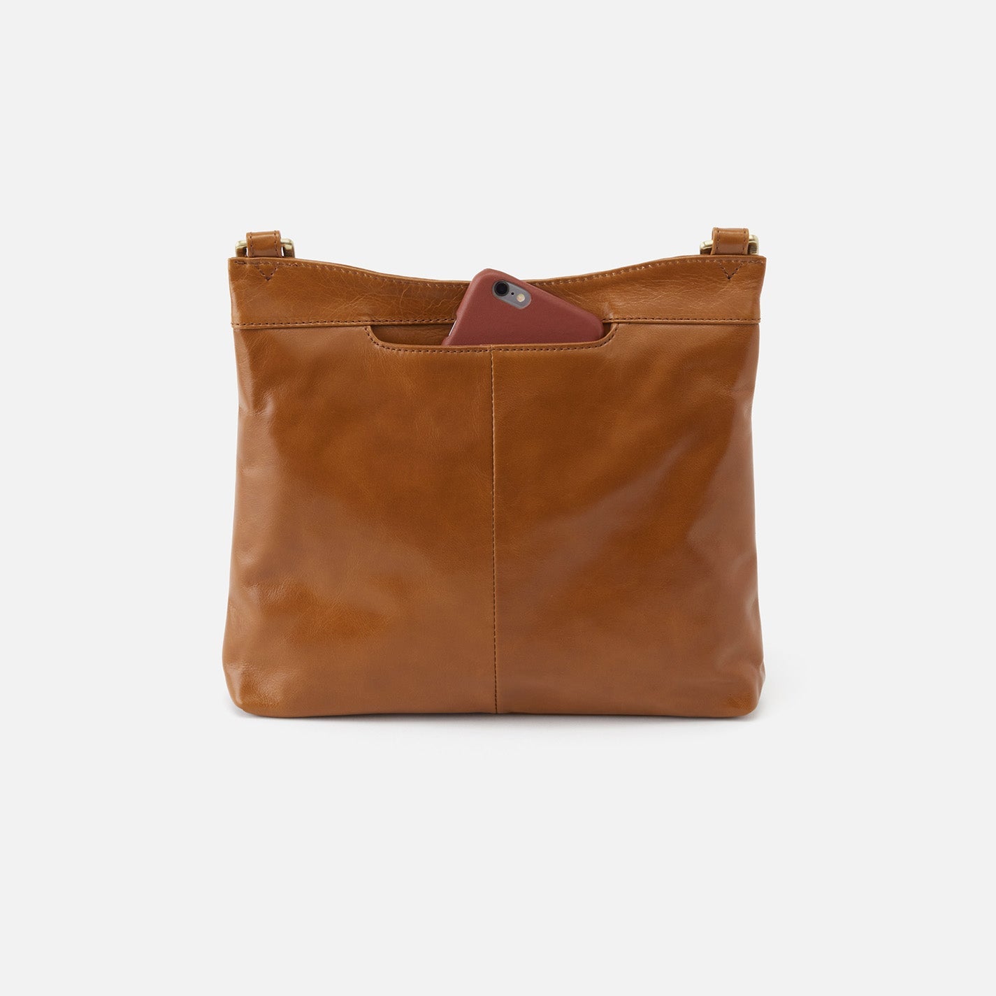 Hobo Cambel Crossbody bag in truffle leather featuring sleek silhouette and practical design.