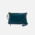 Teal handbag with a strap on a white background