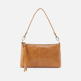 Brown leather handbag with a strap on a white background