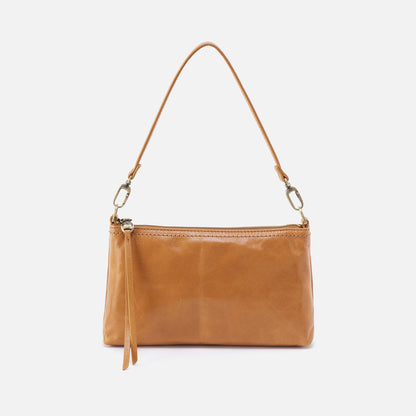 Brown leather handbag with a strap on a white background