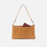 Brown leather clutch with a phone inside on a white background