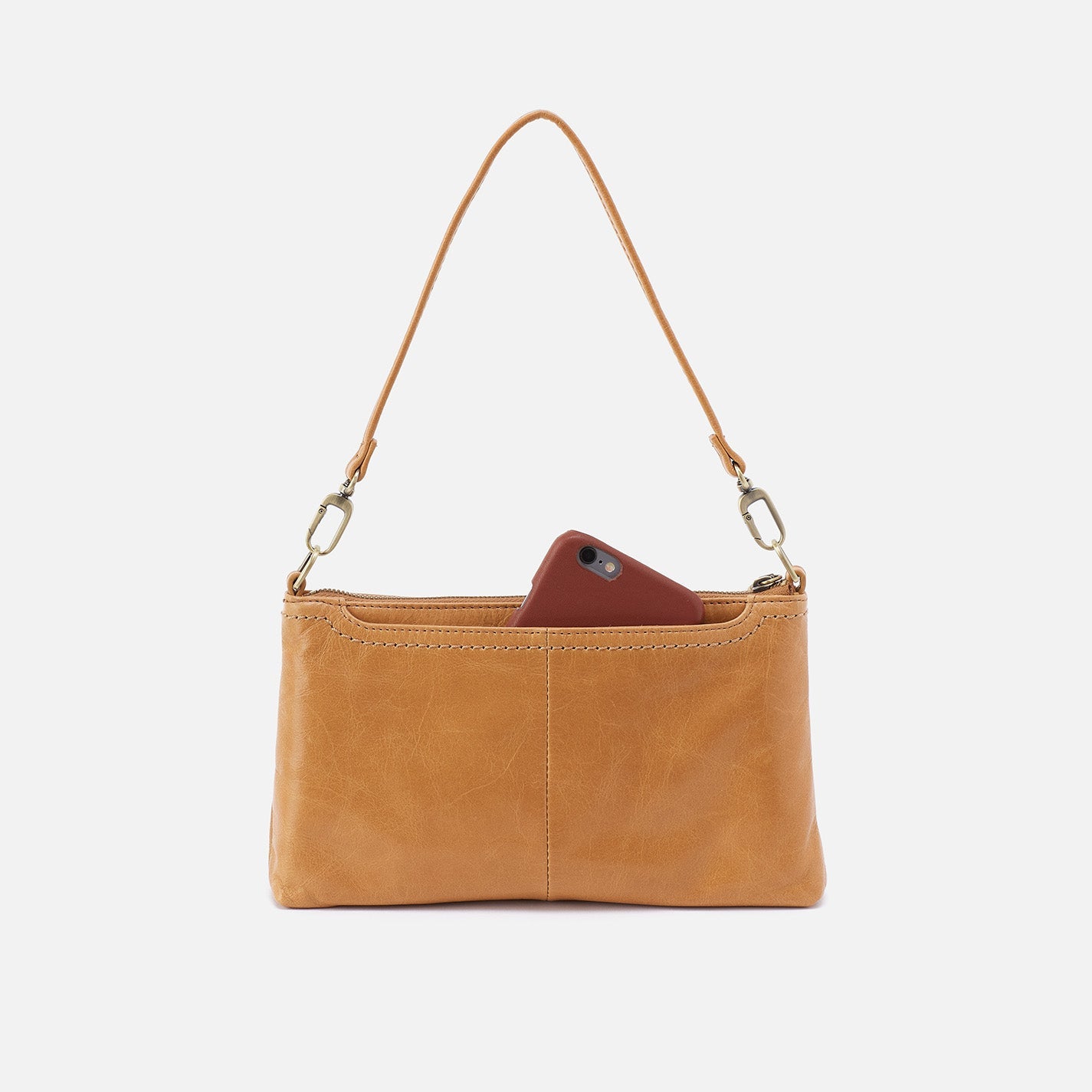 Brown leather clutch with a phone inside on a white background