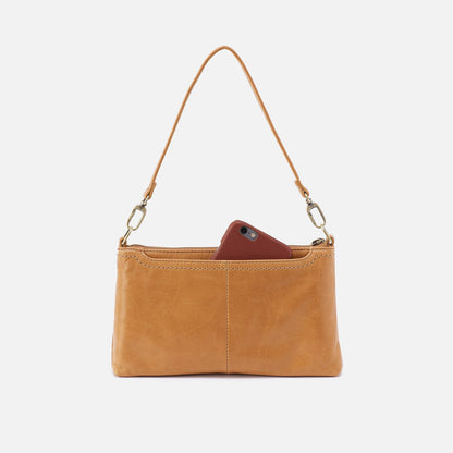 Brown leather clutch with a phone inside on a white background