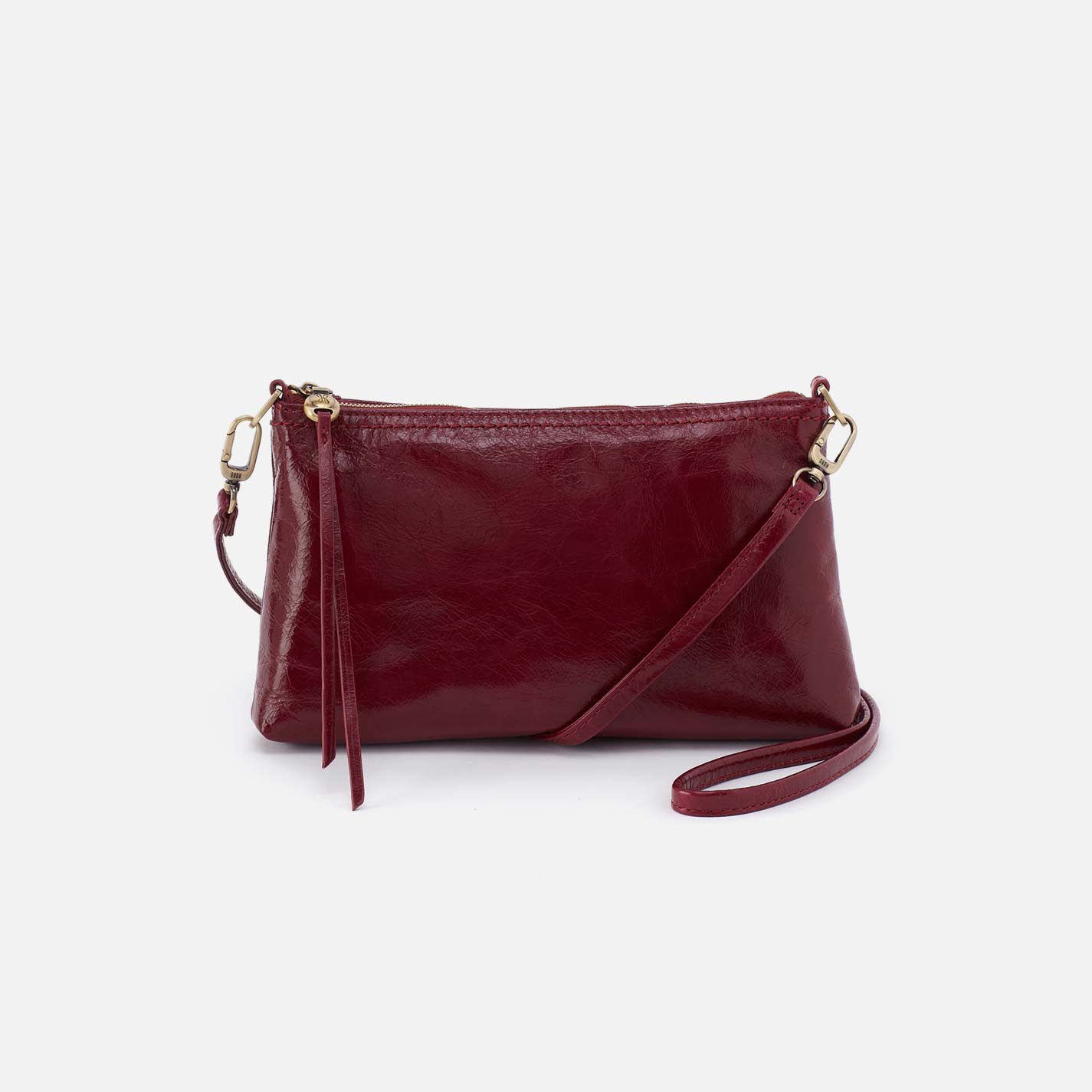 Maroon leather crossbody bag on a white background