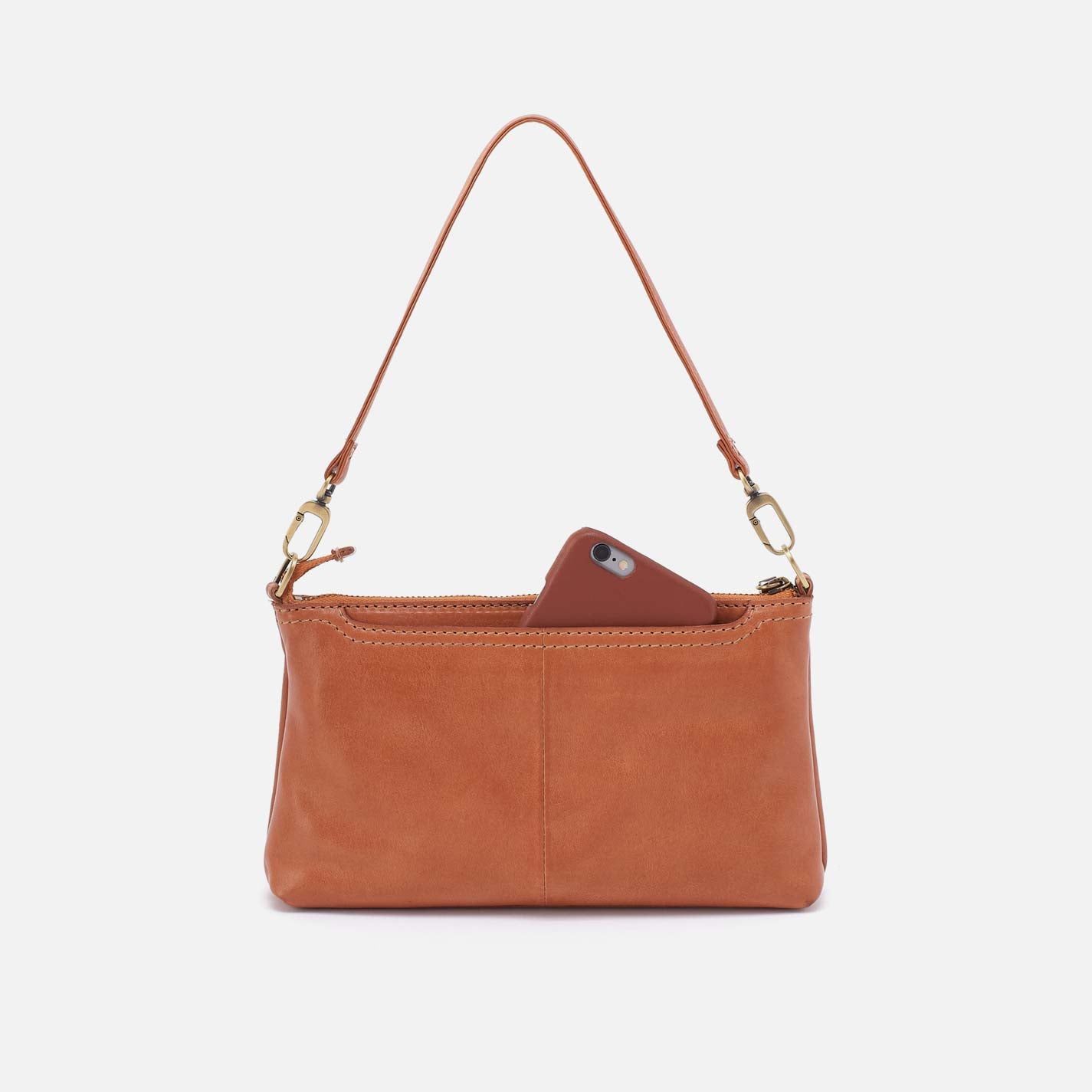 Brown leather handbag with a phone inside on a white background