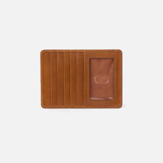 Brown leather wallet on a light gray background