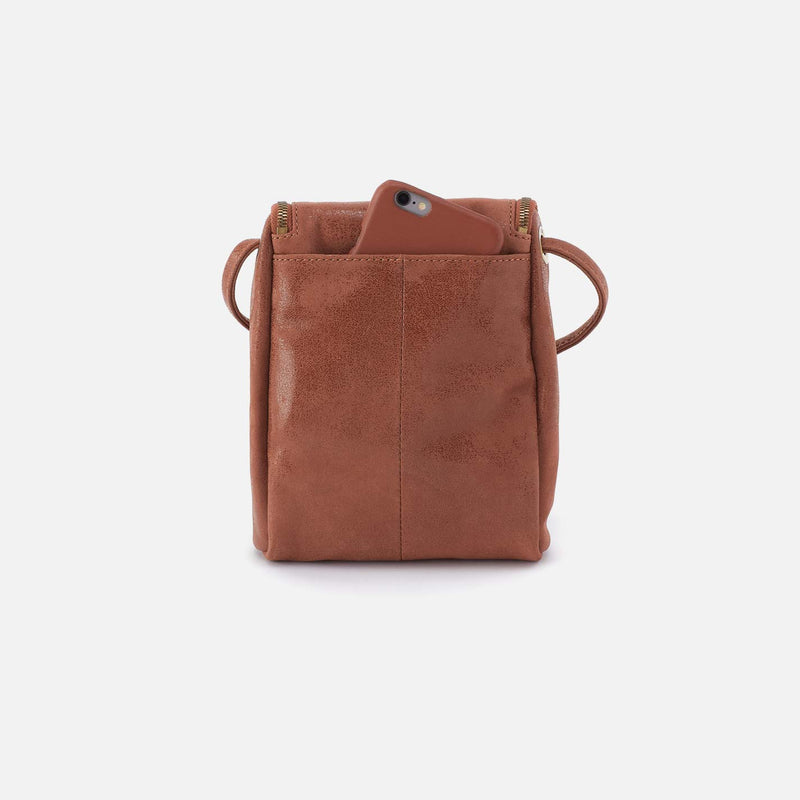 Brown leather crossbody bag on a white background