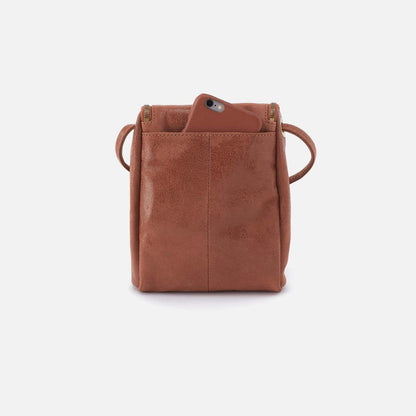 Brown leather crossbody bag on a white background