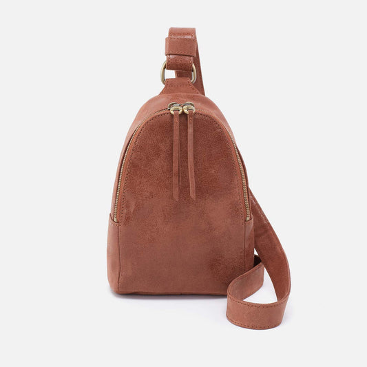Brown suede sling bag on a white background