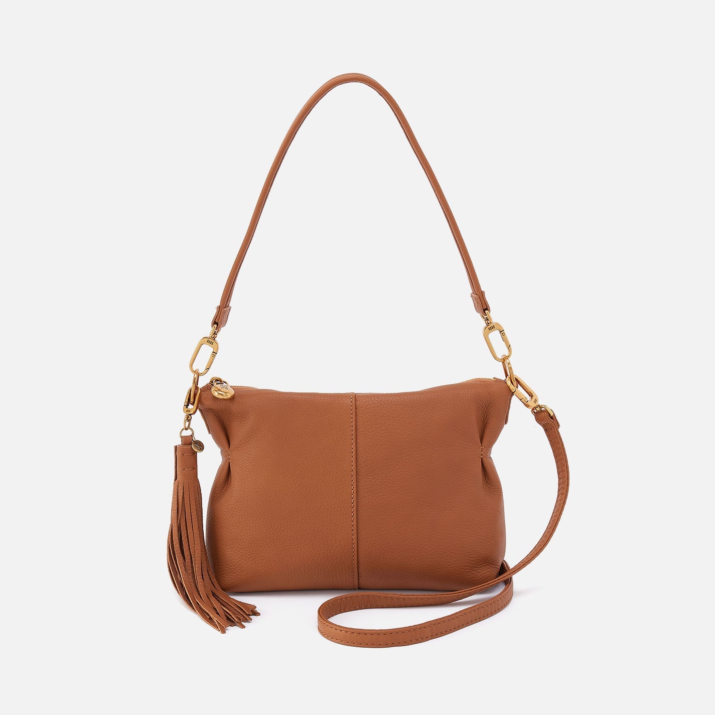 Hobo Kori Crossbody in warm honey leather with adjustable strap and zip closure