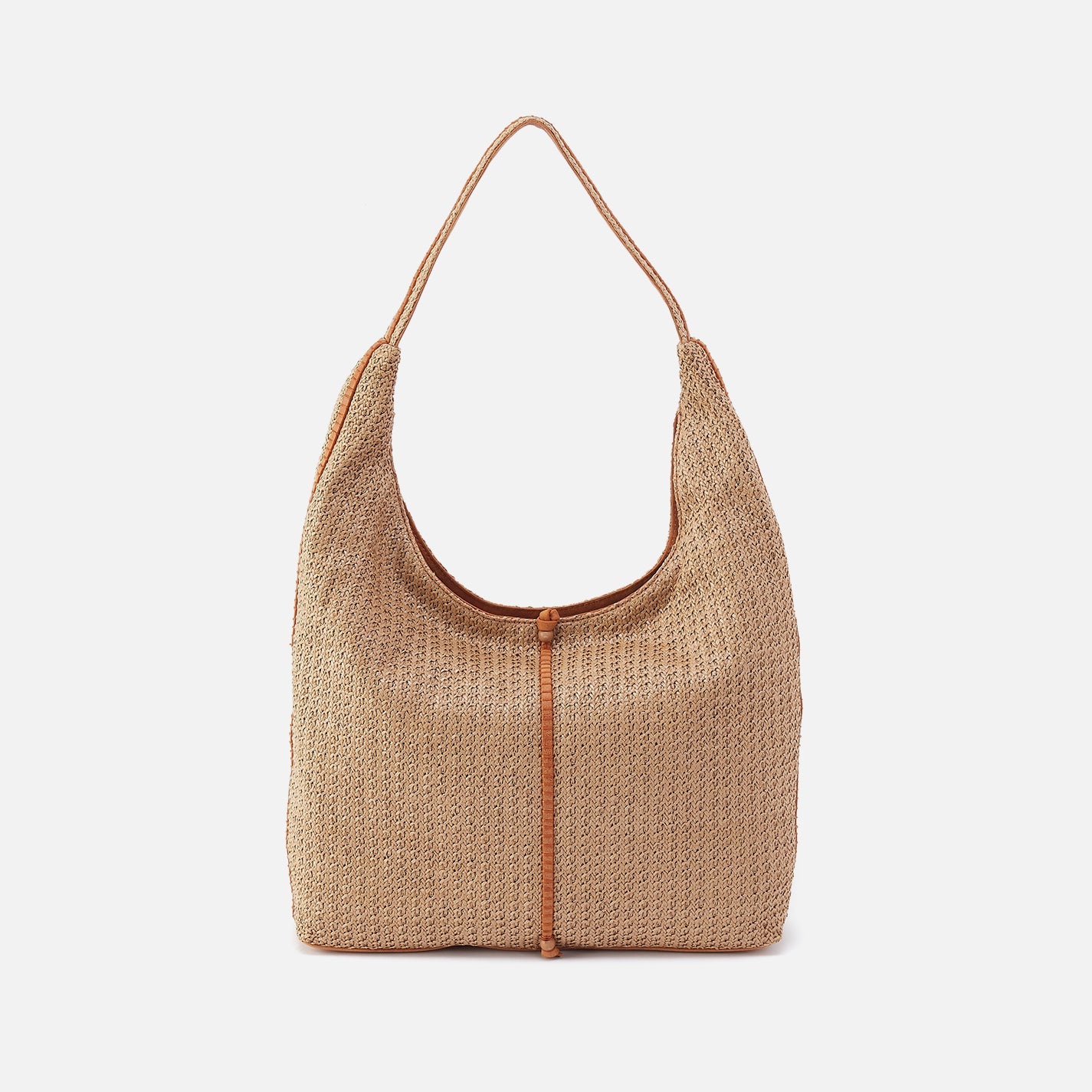 Woven handbag with leather accents on a white background