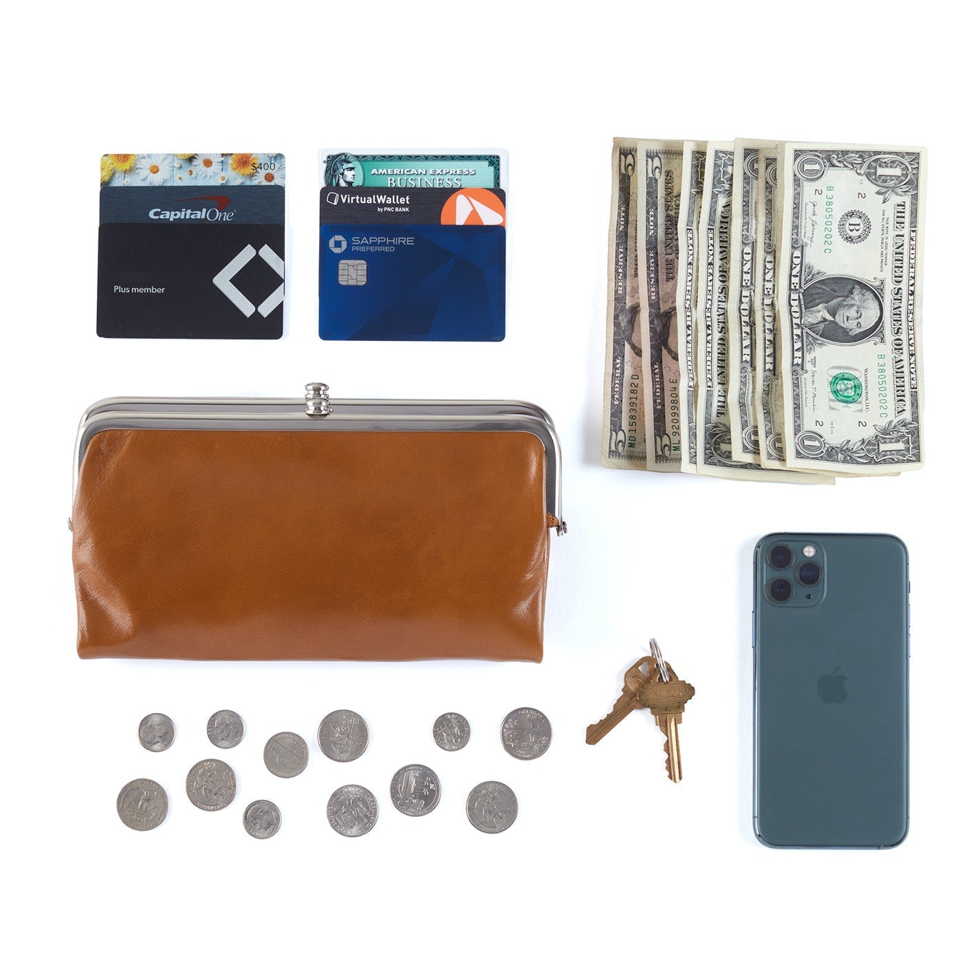 Brown wallet, cards, money, coins, keys, and phone on a white background