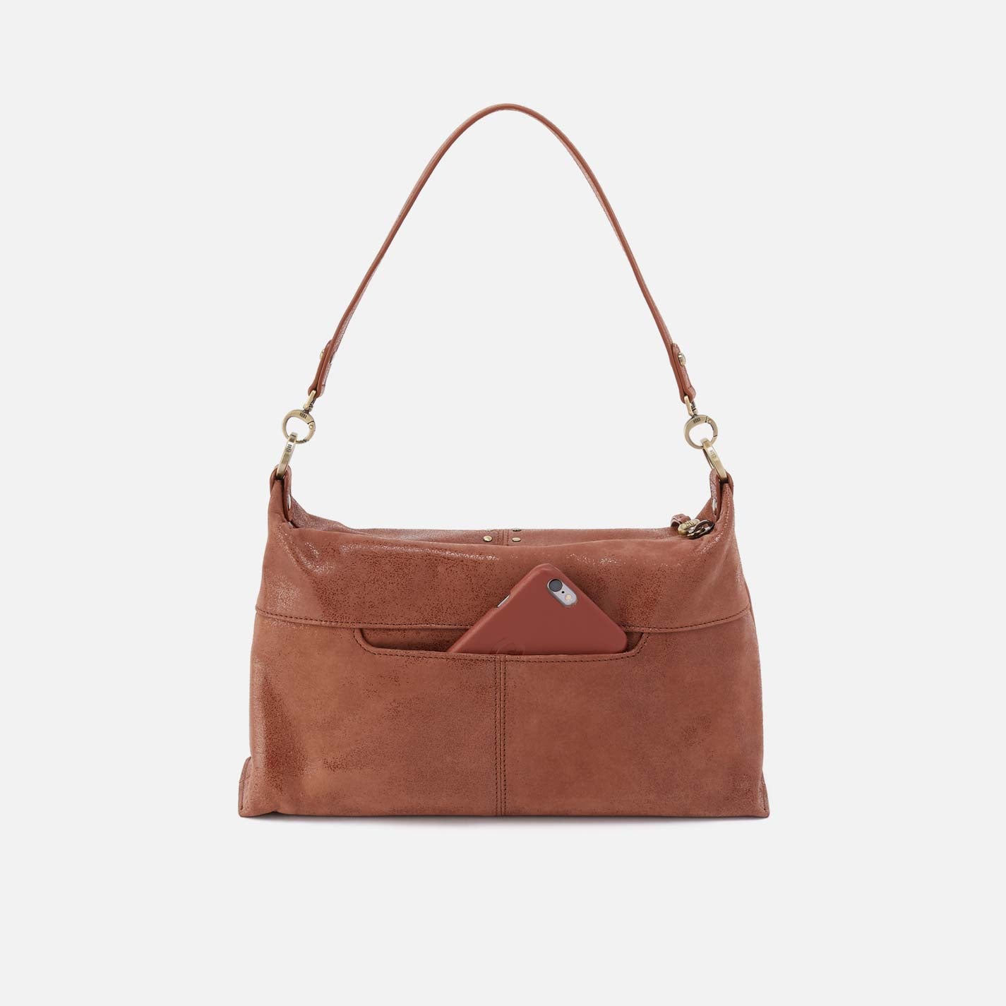 Brown leather handbag with a strap on a light gray background