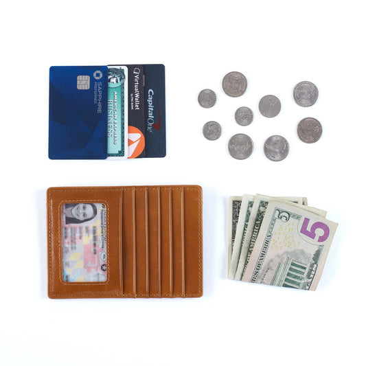 Brown wallet with cards, money, and coins on a white background