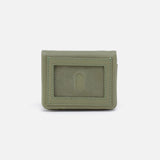 Green wallet with a card holder on a white background